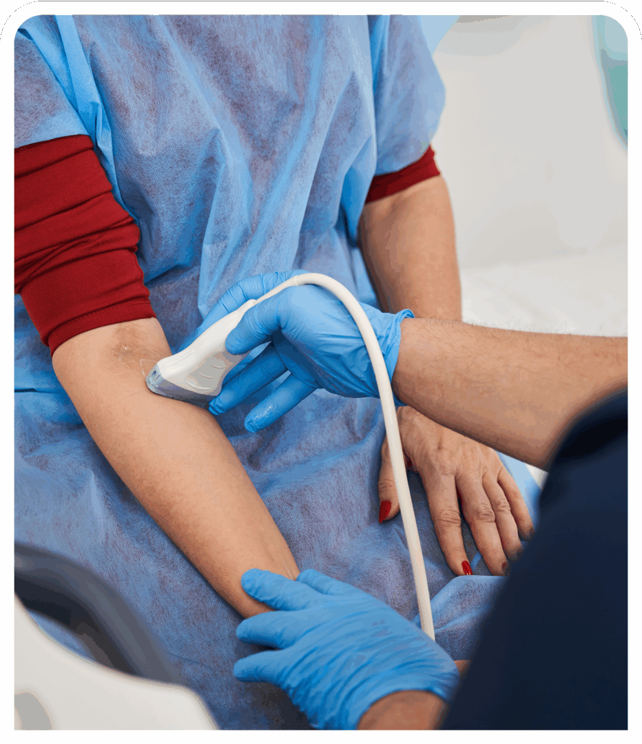 Ultrasound procedure on patient's arm in hospital.