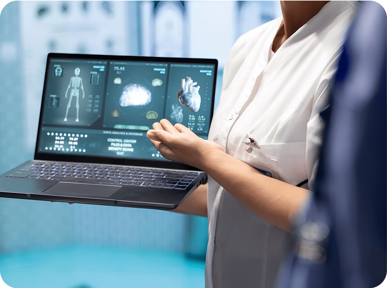 Doctor presenting medical data on laptop.